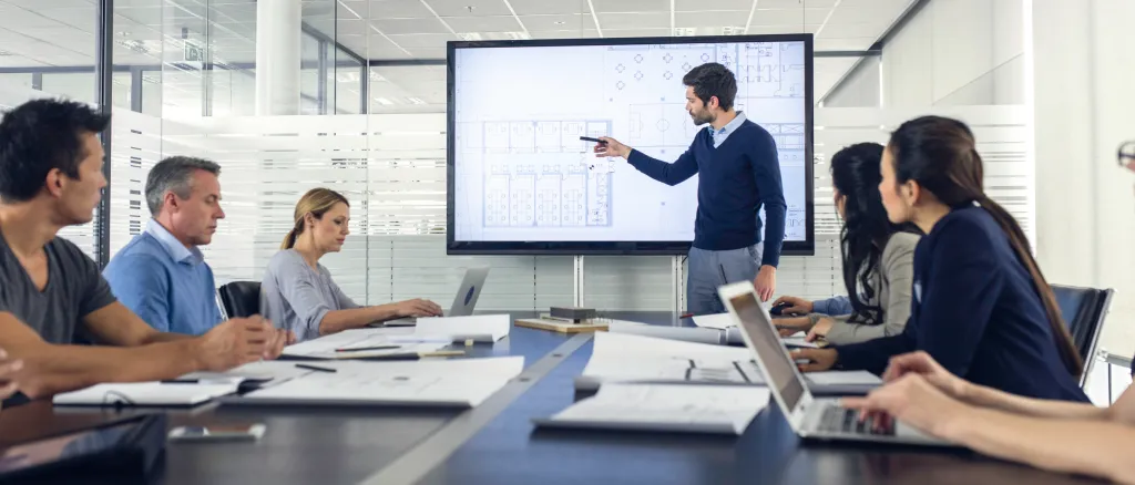 Architect presenting project to a group of managers stock photo